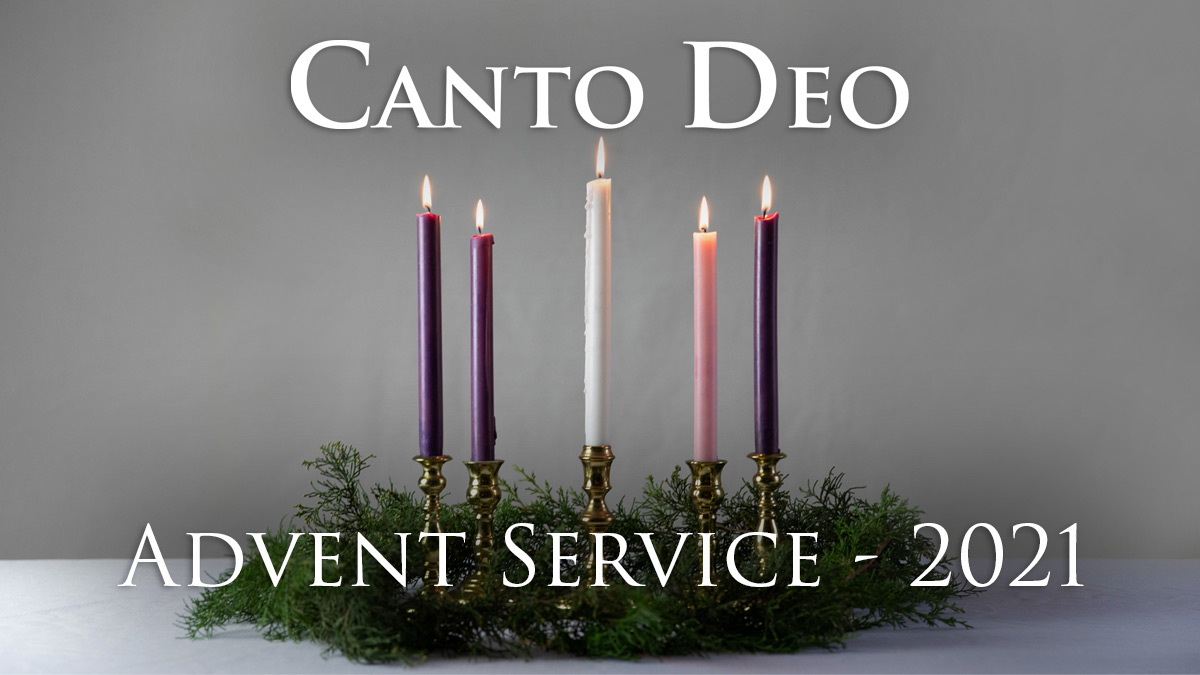 A set of advent candles burning in a green wreath with the words Canto Deo Advent Service 2021